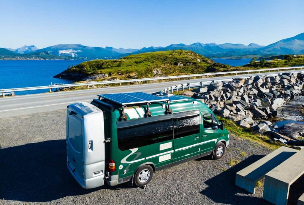 class c RV in norwegian fiords with solar panels - best solar kits hero image